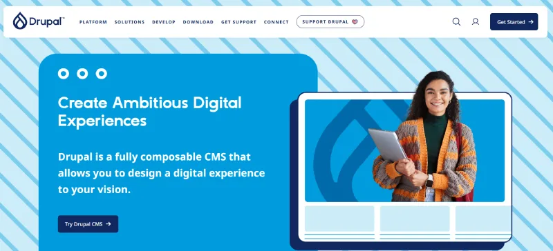 Drupal CMS homepage featuring a woman holding a laptop, promoting enterprise-grade digital experiences, security, and multilingual SEO.