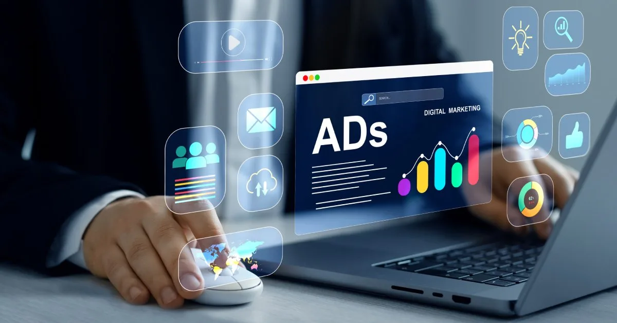 Digital marketer using laptop with advertising analytics icons, illustrating paid search vs paid social strategy differences.