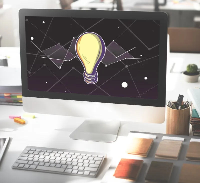 Computer screen displaying a lightbulb icon with network connections representing AI readiness and visibility concepts