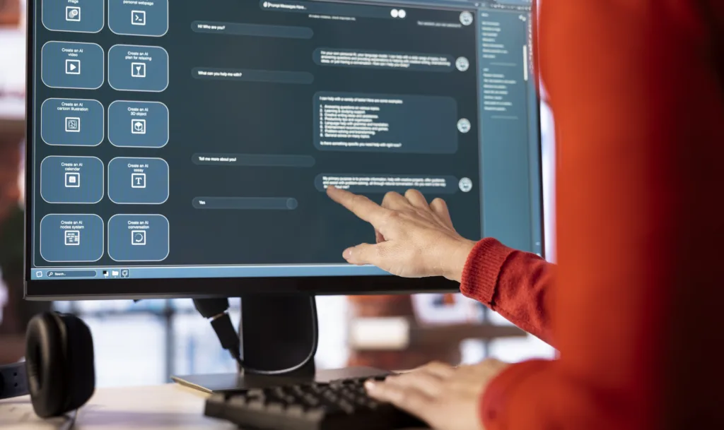 Person reviewing AI readiness assessment dashboard on monitor showing structured data and content analysis