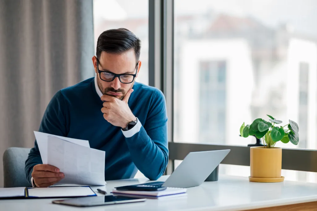 Business professional looking at an incomplete data dashboard showing gaps in the RIA marketing strategy. 