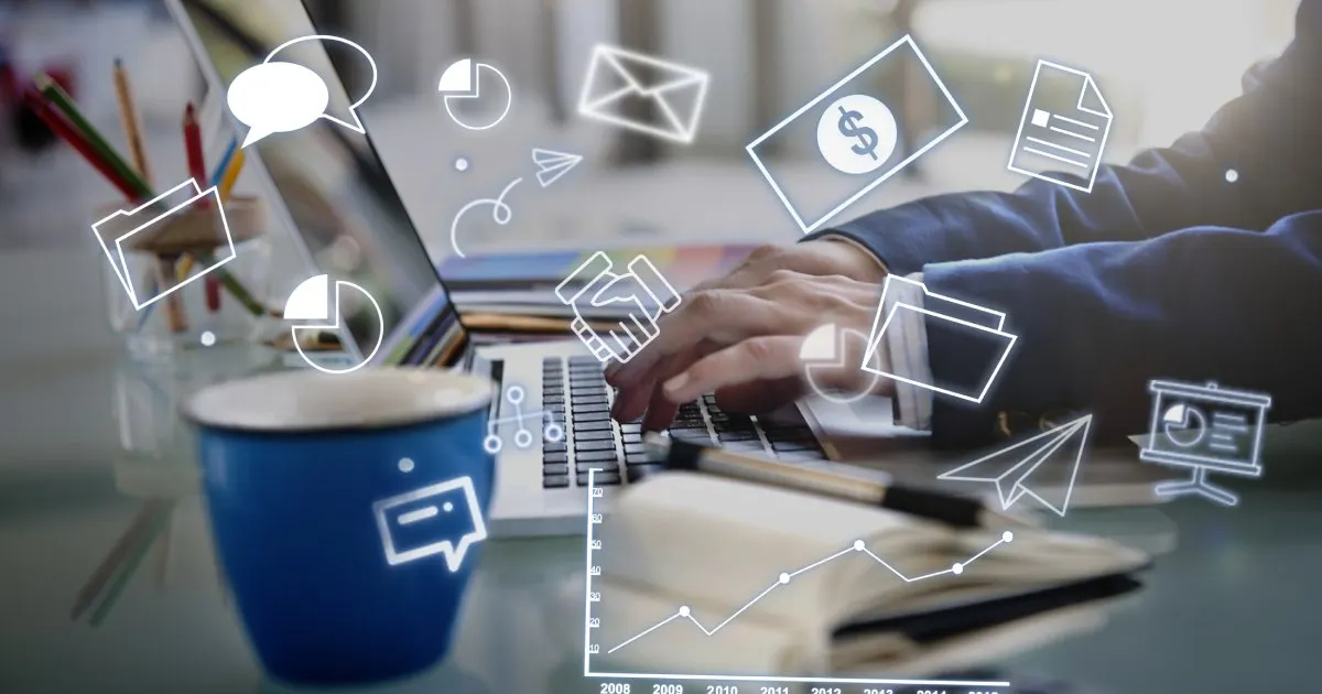 Advisor typing on a laptop beside digital icons symbolizing communication, data, and financial lead generation.