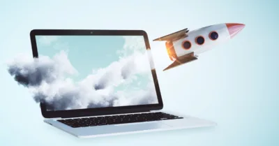 Rocket launching from a laptop, illustrating brand search lift driven by off-site engagement and visibility
