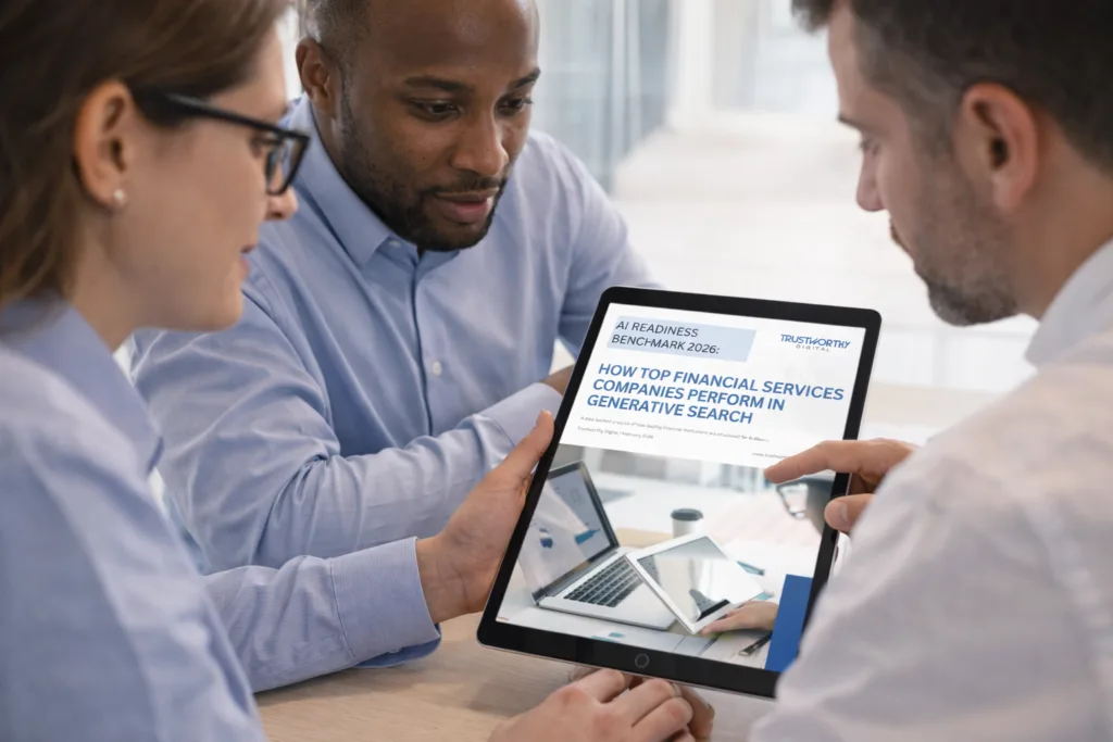 Team of financial advisors looking at the whitepaper on a tablet.