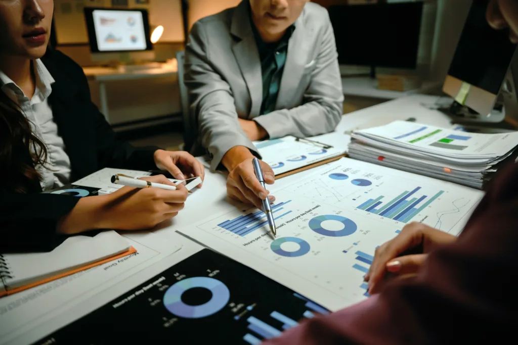 Team reviewing charts and SEO reports during a meeting.