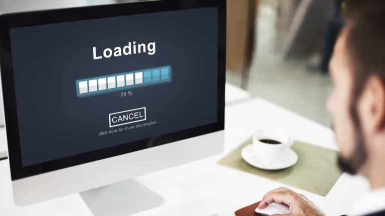 Man watching a slow-loading website, illustrating how site speed affects SEO