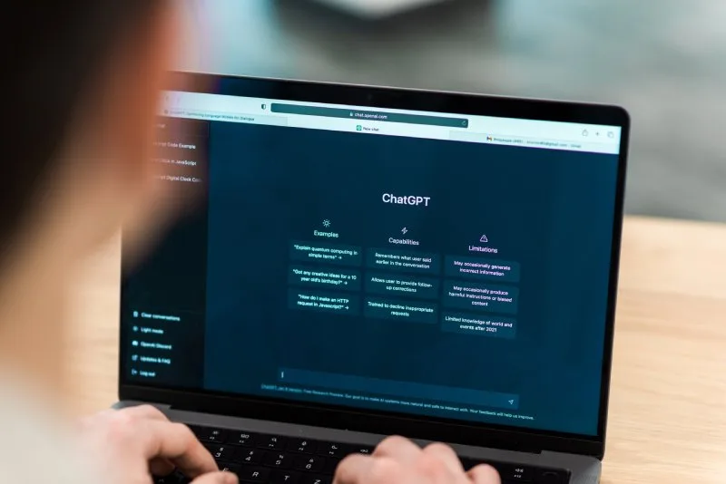 Image showing laptop screen with ChatGPT interface, illustrating AI search optimization tools in action.