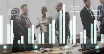 Businessman showing SEO bar chart on tablet during client meeting