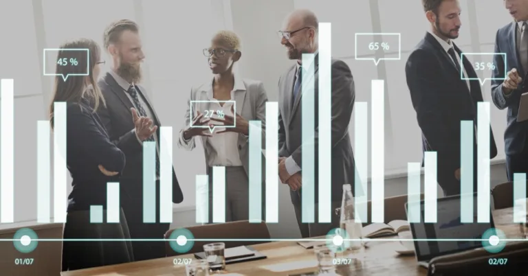 Businessman showing SEO bar chart on tablet during client meeting
