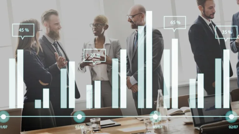 Businessman showing SEO bar chart on tablet during client meeting