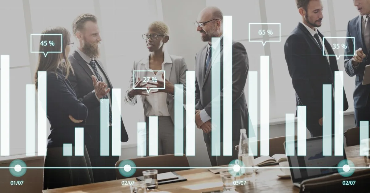 Businessman showing SEO bar chart on tablet during client meeting