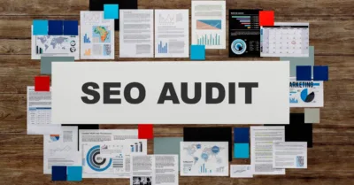 Audit report documents laid out, highlighting the importance of SEO analysis.